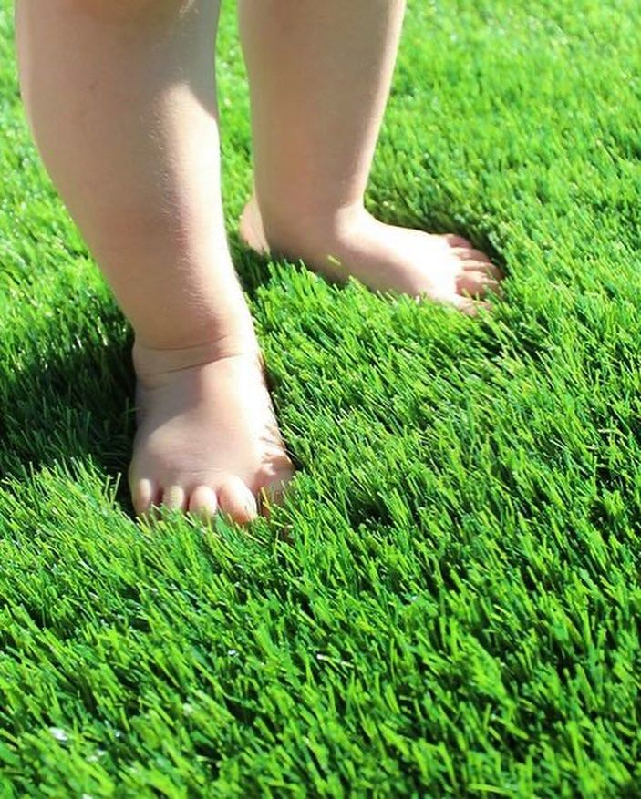 Professional artificial grass installation in a Dubai villa garden - lush green lawn