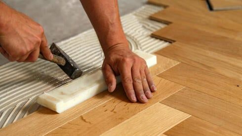 Professional flooring installation in progress